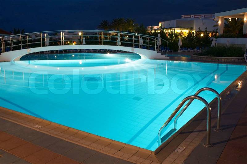 Night illumination in the swimming pool in resort, stock photo