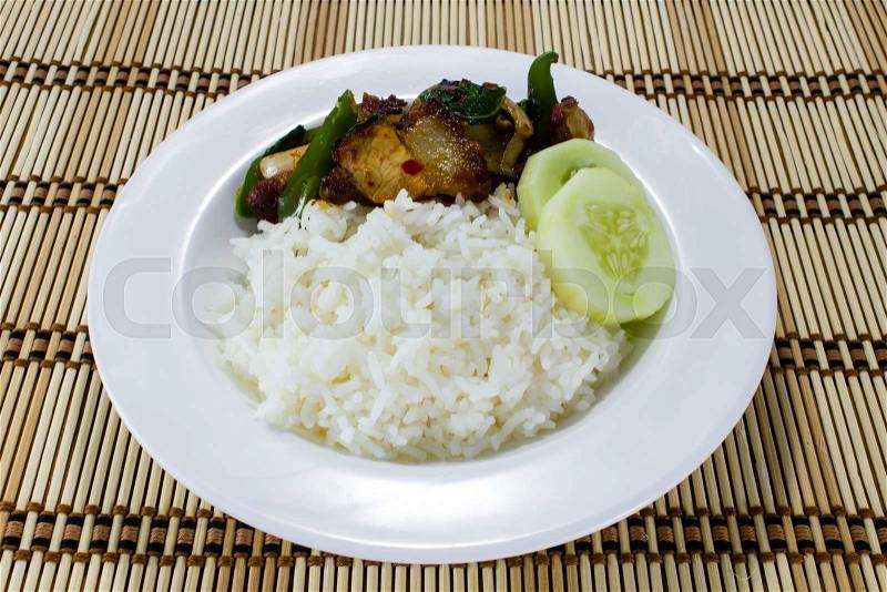 Rice and Stir-fried crispy pork in white dish, stock photo