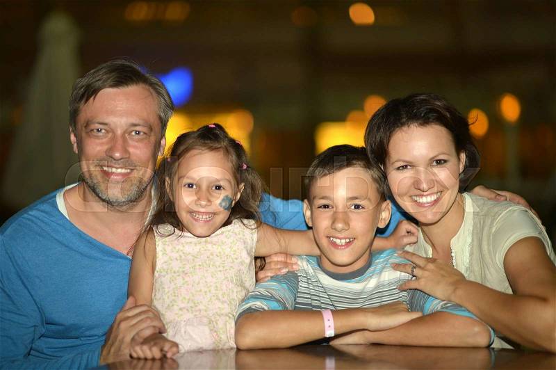 Portrait of a happy family in cafe , stock photo