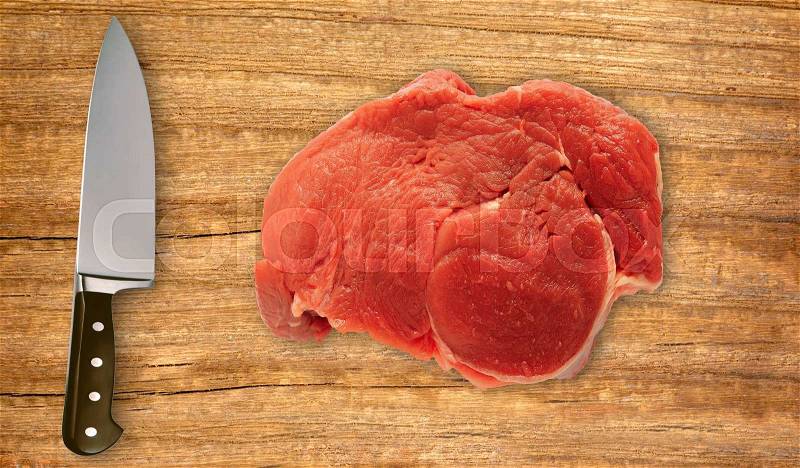 Knife on cutting board and fresh meat isolated on white background, stock photo
