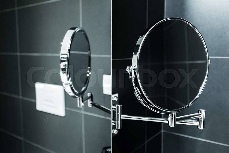 Elegant Stylish Magnifying Mirror Mirroring in Traditional Bath Mirror. Bathroom Accessories, stock photo