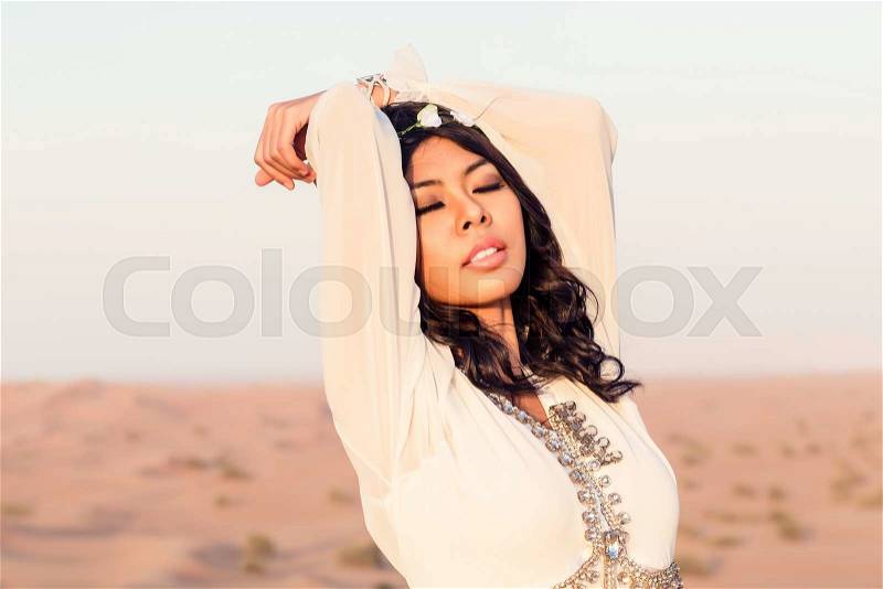Tourist woman in Arabian Desert on vacation in Arabia, stock photo