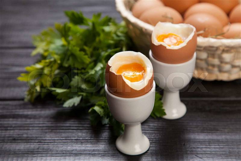 Fresh boiled eggs on dark background, stock photo