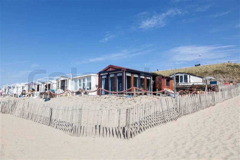 Vacation homes on the sandy beach in North Holland, Netherlands, stock photo