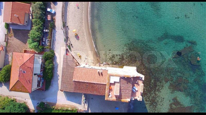 Torre Mozza, Italy. Overhead view of ancient tower and public beach, stock photo