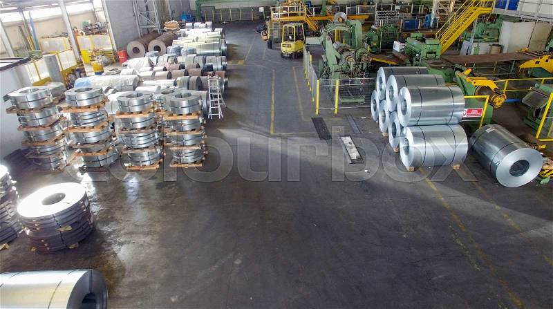 Steel coils in a warehouse, aerial view, stock photo