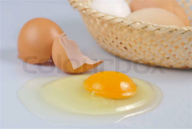 One beige cracked egg with basket on kitchen. Preparation, stock photo