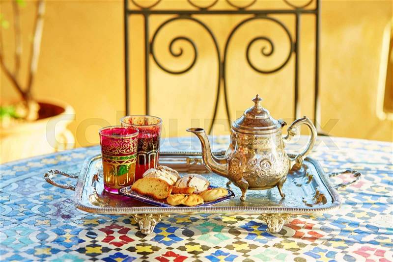 Traditional Moroccan mint tea with sweets, stock photo