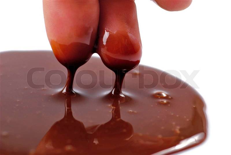 Chocolate on fingers for licking isolated on white background close up, stock photo