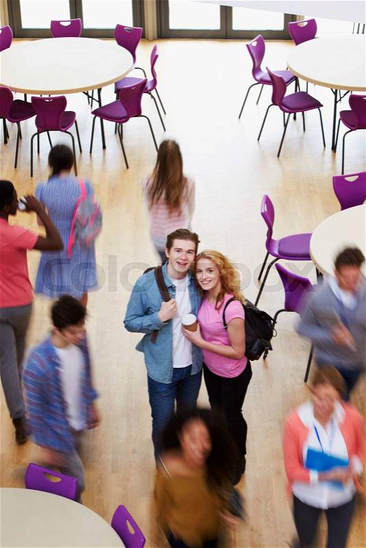 Overhead View Of College Student Couple In Cafeteria, stock photo