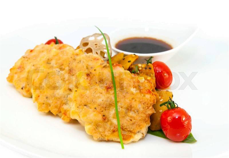Shrimp patties of meat with a salad of eggplant on a white background in restorne, stock photo
