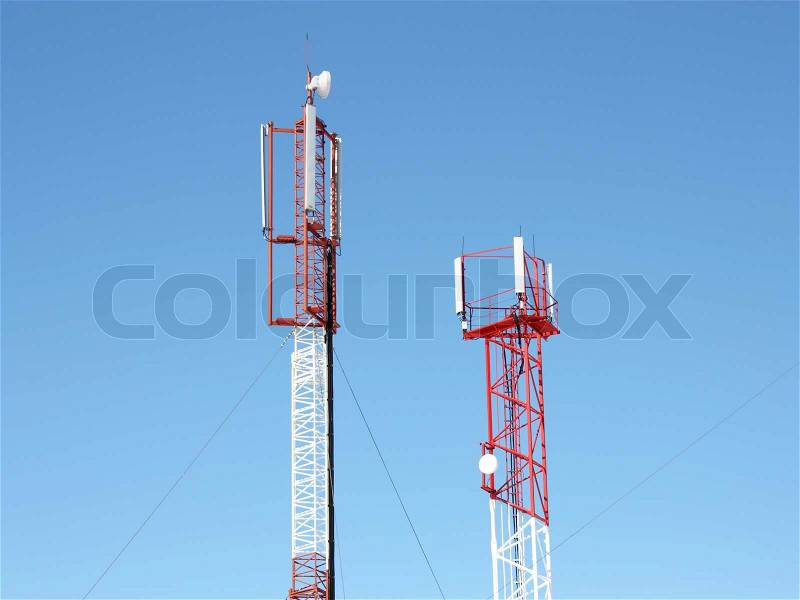 Mobile telecommunication technology antenna (radio antenne) for wireless mobile phone connections on blue sunny sky. Electrical wireless equipment concept, stock photo