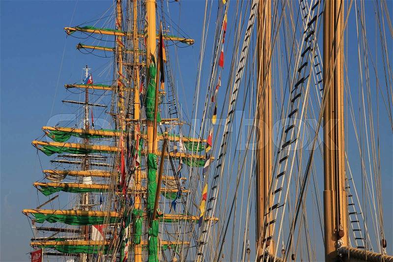 Many flags and sails on the tallship during Sail Amsterdam 2015, stock photo