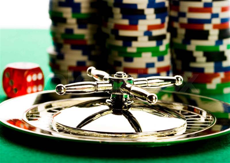 Roulette and Chips, ambient light saturated theme, stock photo