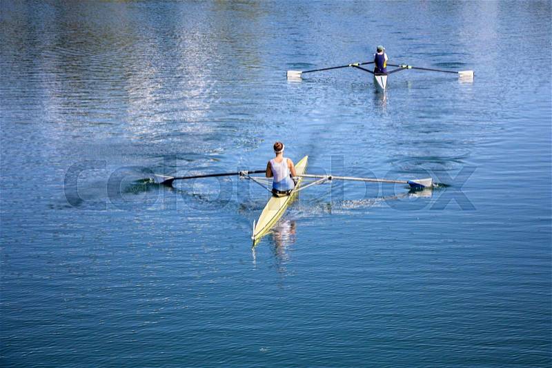 Two Young girl rowers training rowing on the Lake Jarun, stock photo