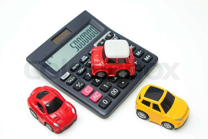 Toy car and calculator. Concept for finance and insurance, stock photo