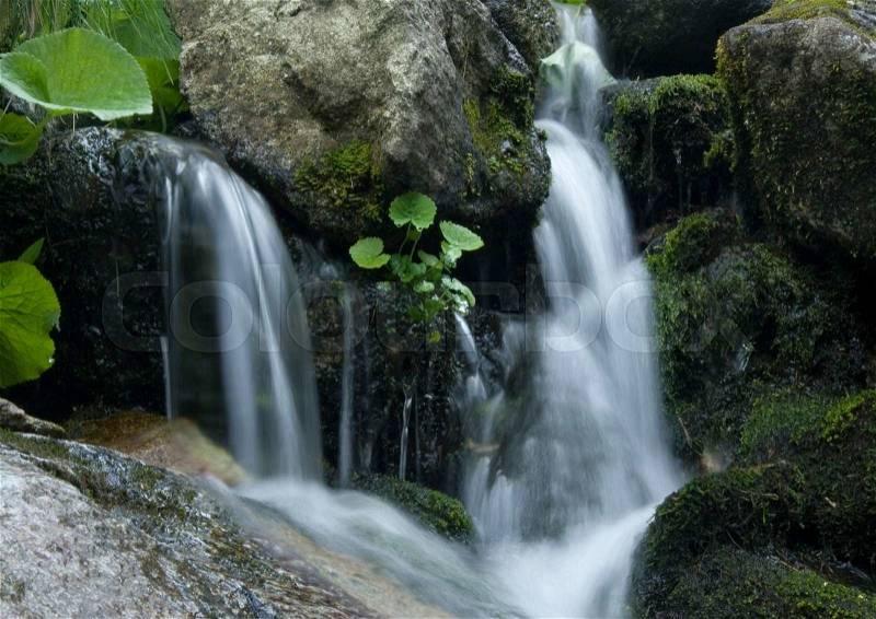 Mountain waterfall, pure nature beautiful landscape, stock photo