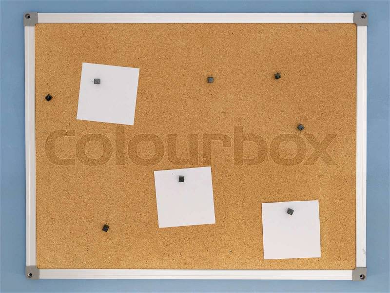 A close up shot of a cork notice board, stock photo