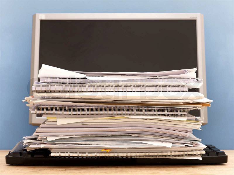 A close up shot of a paper pile on a work desk, stock photo