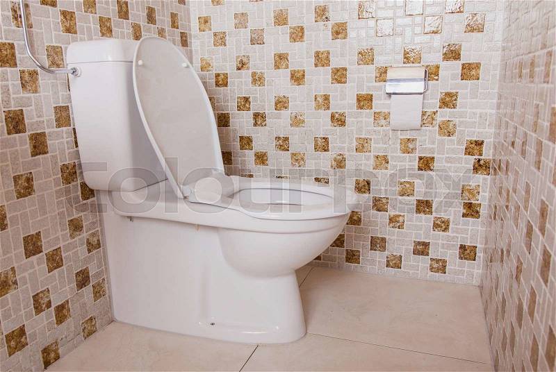 Old clean toilet with old tiles (80s), stock photo
