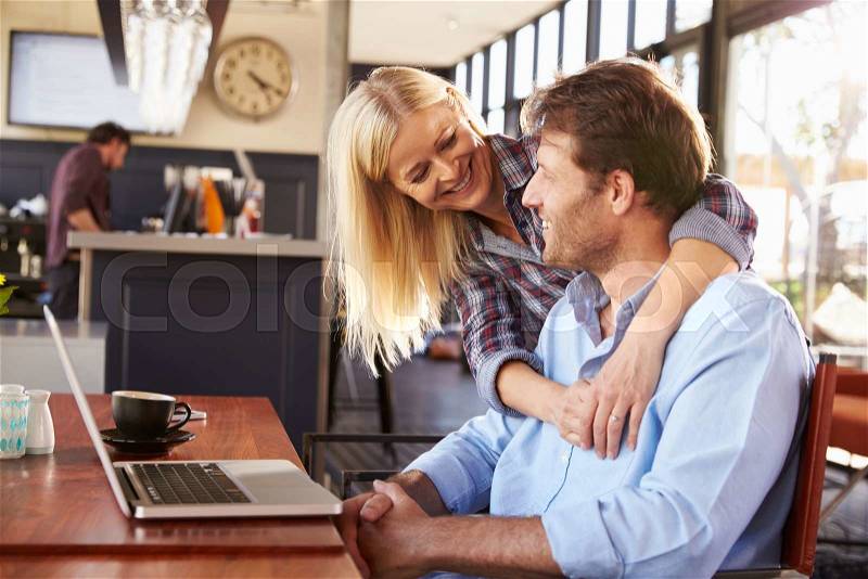 Couple meeting at a coffee shop, stock photo