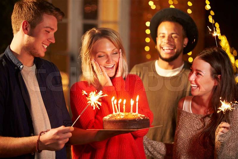 Group Of Friends Celebrating Birthday At Outdoor Party, stock photo