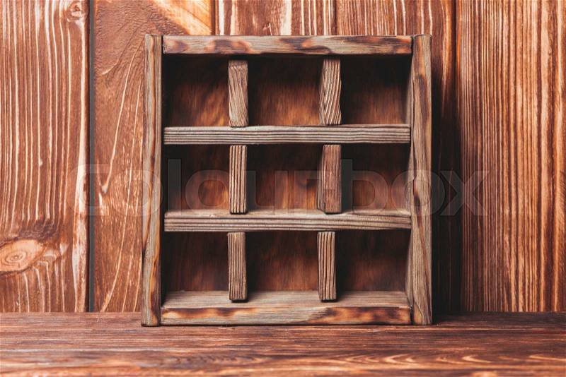 Vintage shelf stand on the wooden background, stock photo