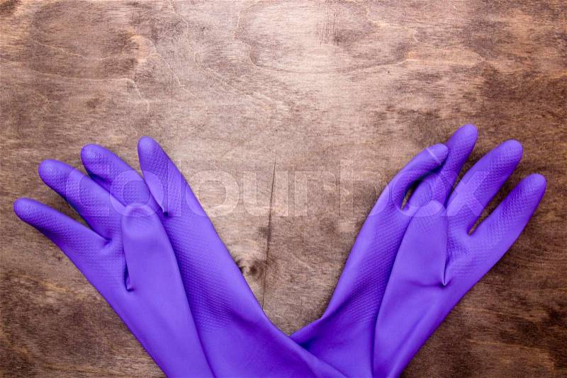 Rubber gloves purple color of thick rubber to save your hands from dirt, stock photo