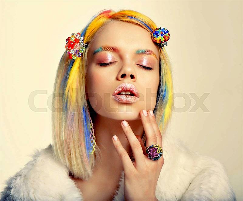 Portrait of fashion woman with bright professional color makeup and hairstyle posing in studio.Beauty face, stock photo