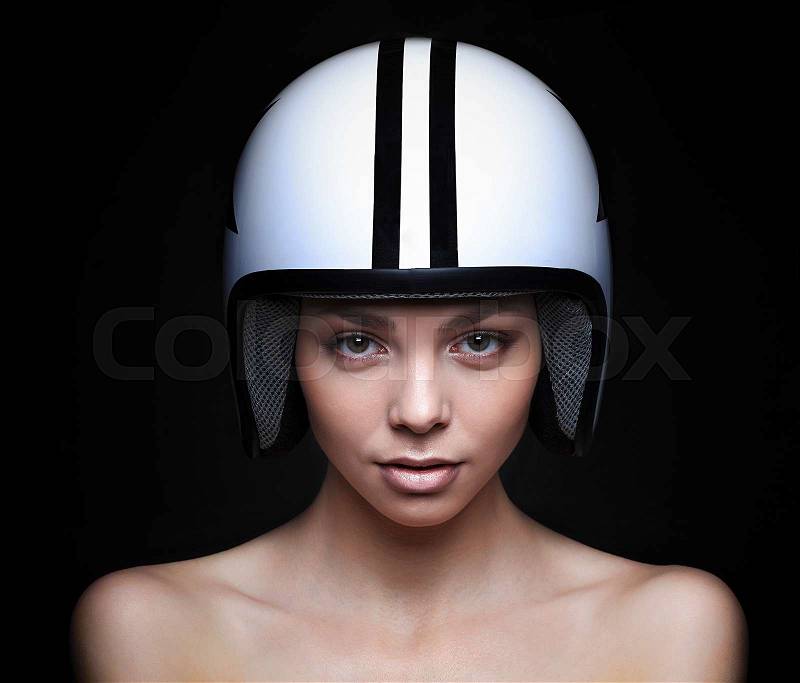 Portrait of beautiful young woman in shirt,white helmet pictured with star and stripes poses gesticulating arms on black background.Studio shot.Fashion look.Perfect clean skin.Stylish image.Nature makeup.Slim body.Skinny.Full lips, stock photo