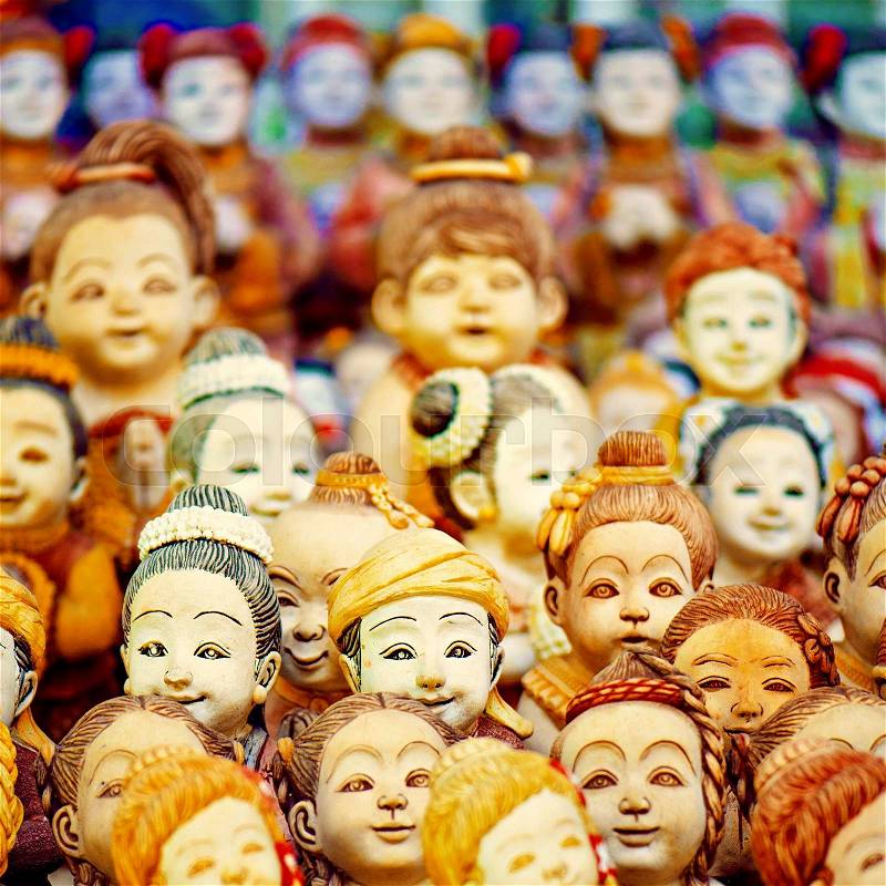 Charming faces of attractive doll crowd in front and bacrground, stock photo