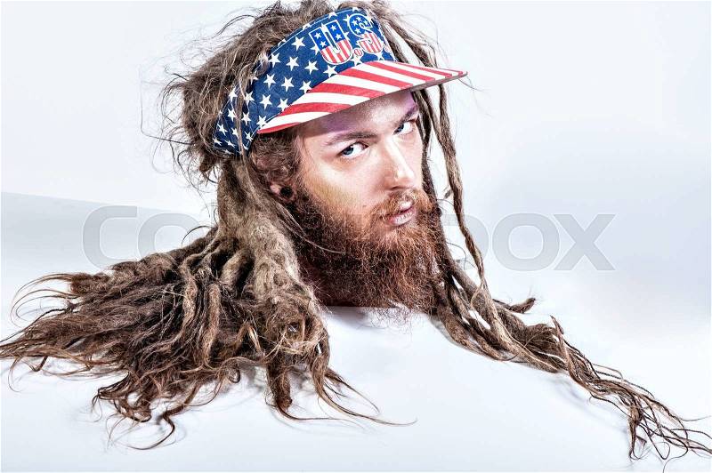 Closeup wild hipster man face long beard and hair black and white, stock photo