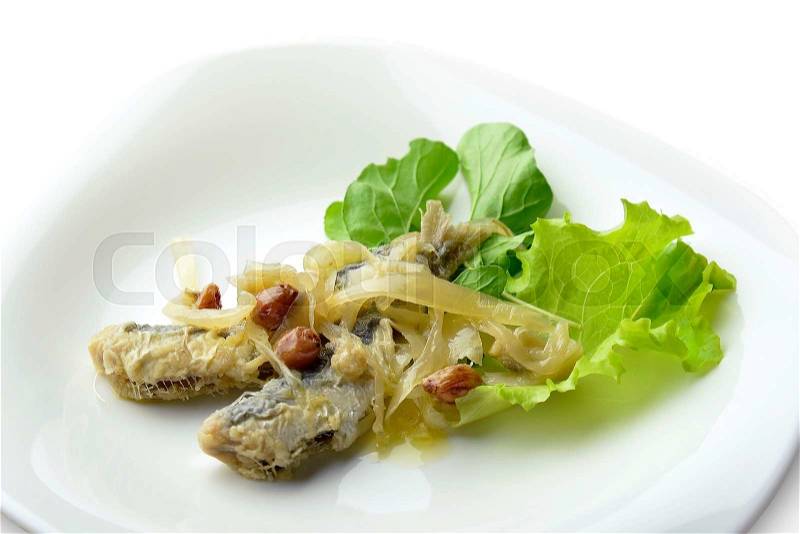 Appetizer of Fish Marinated Anchovies in white plate, stock photo