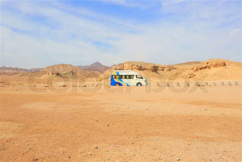 Tourist Van in the desert in Egypt, stock photo