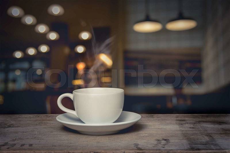 Cup of coffee on table in cafe, stock photo