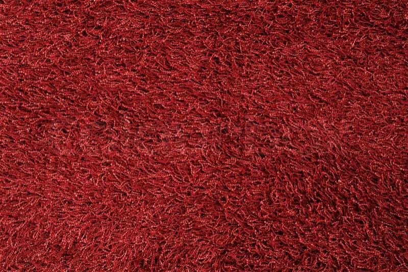New red fluffy rug background texture, stock photo