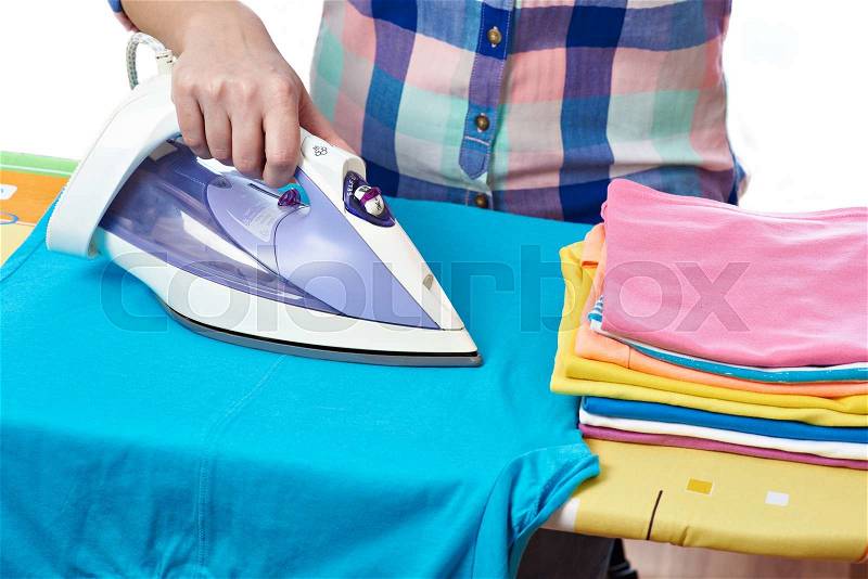 Woman ironed men\'s t-shirt close-up, stock photo