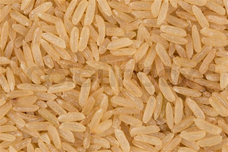 Uncooked Brown rice background close up image, stock photo