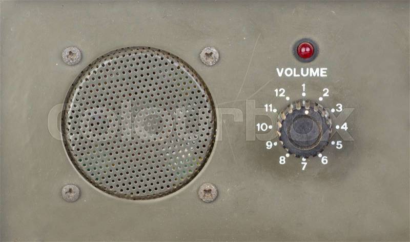 Old style dial volume switch with speaker and red light indicator, stock photo