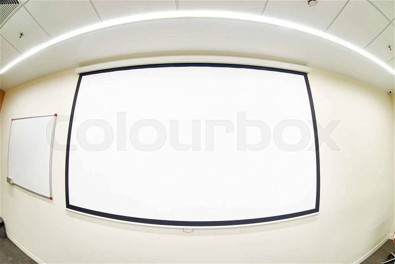 Conference room with empty projector screen, stock photo