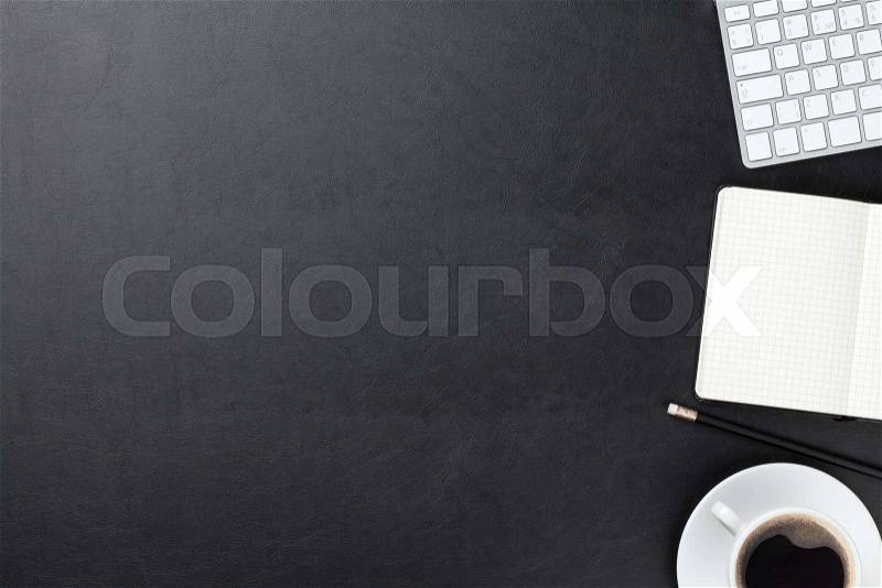Office leather desk table with computer, supplies and coffee cup. Top view with copy space, stock photo