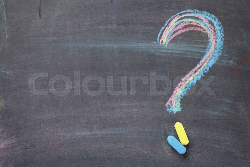 Colorful chalk question mark on blackboard background with copy space, stock photo