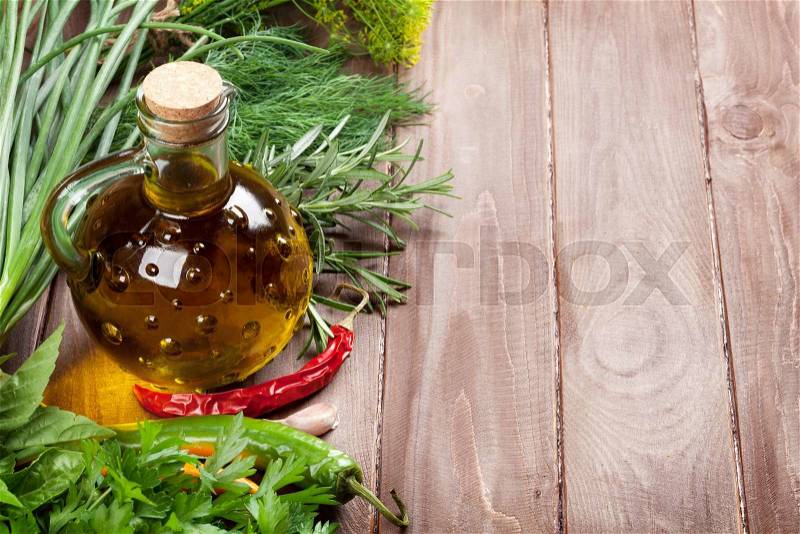Fresh garden herbs and spices on wooden table. View with copy space, stock photo