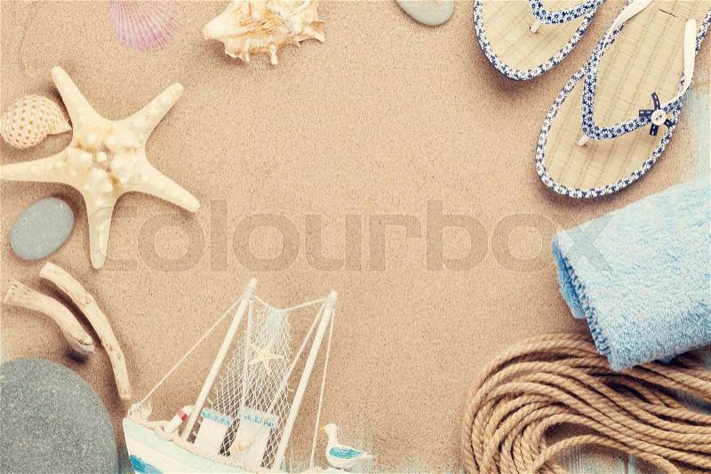 Travel and vacation items on sea sand. Top view with copy space. Toned, stock photo