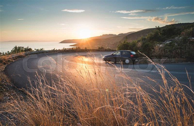 Mediterranean road on sunset. Cloudy sky, stock photo