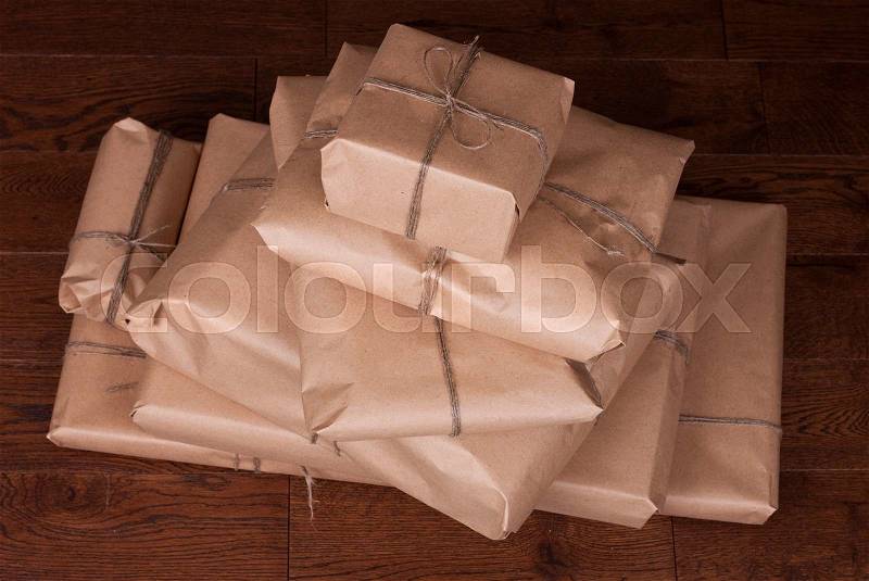 Vintage gift box package on a wooden background, stock photo