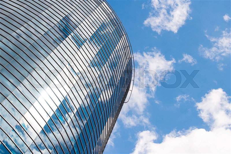 Modern round glass building in the city, stock photo