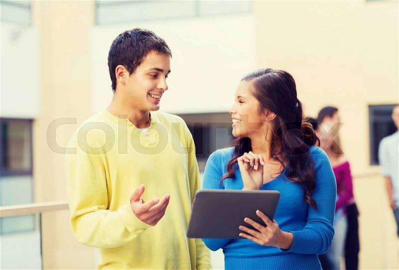 Friendship, people, technology and education concept - group of smiling students with tablet pc computer outdoors, stock photo
