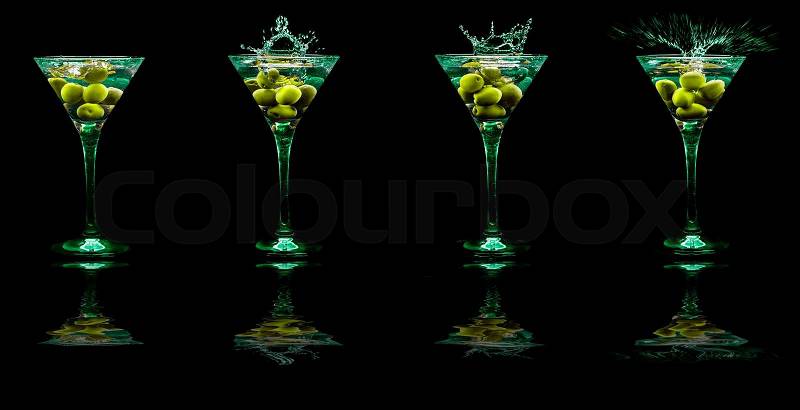 Bright cocktails in glasses isolated on the black, stock photo