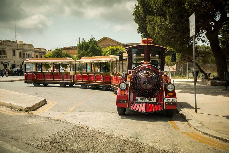 MEDINA, MALTA - MAY 26: Excursion train in the historical part of the city. Medina, Malta on May, 26 2015. Medina - this is the first capital of Malta, stock photo